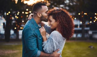 Young couple embracing outside