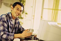 Picture of a man sitting at a computer